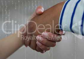 Business people shaking hands against grey background