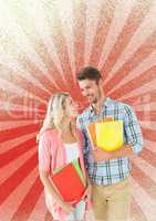 Happy young students holding notebooks against red and white background