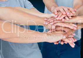 Lots of hands together with blue background