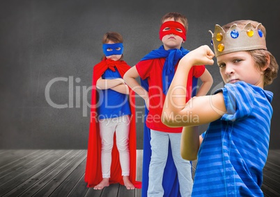 Superhero kids and king crown boy with blackboard background