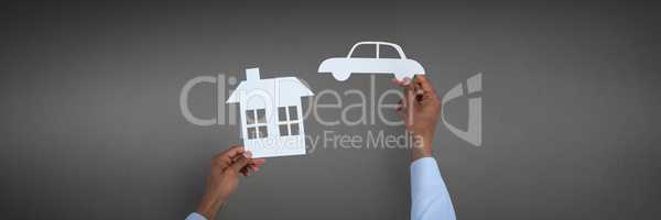 Car and house insurance concept against grey background