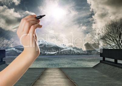 Hand writing in sky of mystical dramatic landscape