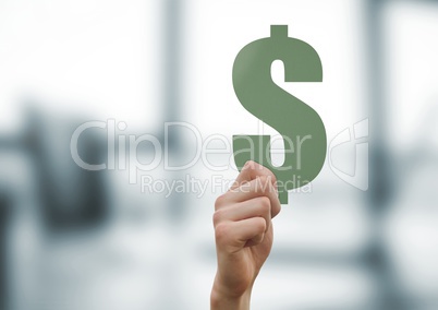 Hand holding dollar cut out by windows