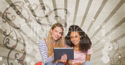Happy young students holding a tablet against brown and white splattered background