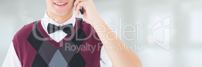 Happy man talking on the phone against white background with lights