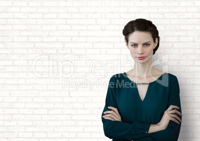 Business woman standing against white wall background