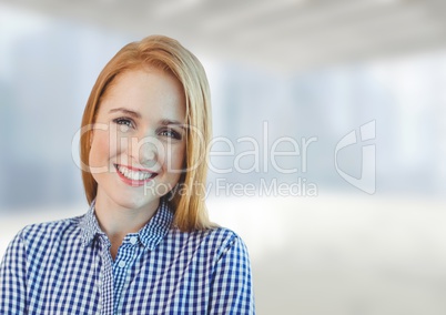 Happy business woman standing against white and blue blurred background