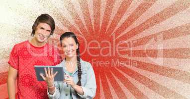Happy young students holding a tablet against red and white background
