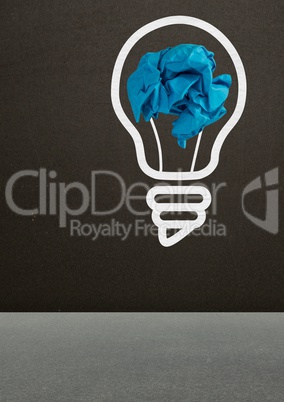 light bulb with crumpled paper ball in front of blackboard