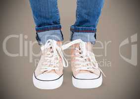 Feet and shoes with brown background