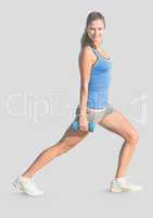 Full body portrait of athletic slim woman exercising with grey background