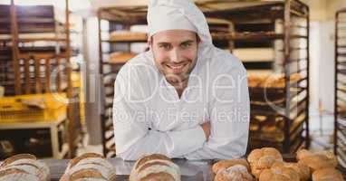 Happy small business owner man making bread