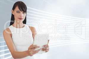 Business woman holding a tablet against white and blue background