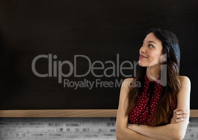 Woman standing in front of blackboard