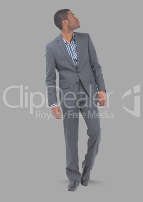 Full body portrait of man standing with grey background