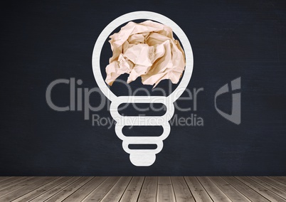 light bulb with crumpled paper ball in front of blackboard