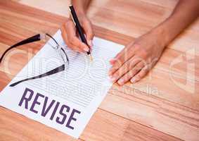 Revise  text written on page with wooden table
