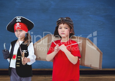 Pirate girl and pilot boy in front of blue wall