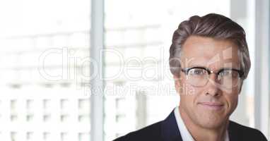 Business man standing against white blurred background