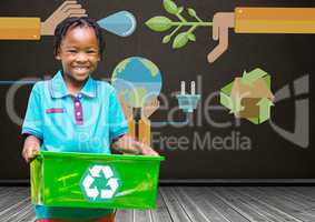 Boy holding recycling box in front of blackboard with recylcing graphics