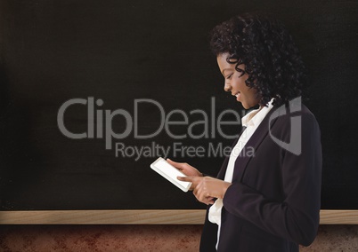 Woman on device with blackboard