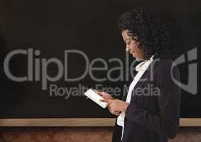 Woman on device with blackboard