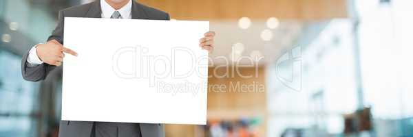 Business man holding a blank card