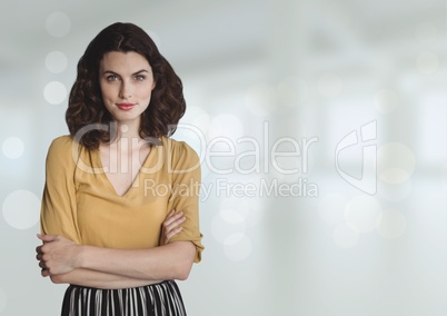 Business woman standing against white blurred background