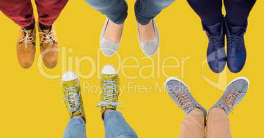 Feet and shoes with yellow background