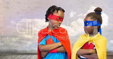 Superhero kids with cloudy sky wall