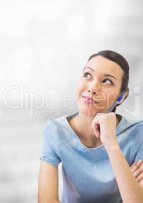 Business woman thinking against white blurred background