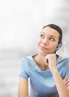 Business woman thinking against white blurred background