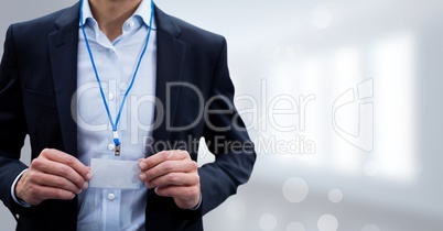 Business man standing against white blurred background