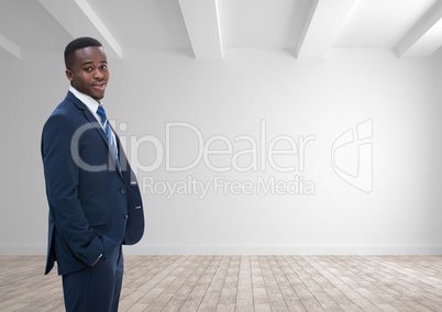 Business man standing against white wall background