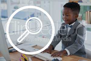 Magnifying glasses icon against office kid boy using a computer background