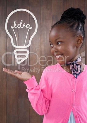 Happy office kid girl holding a bulb icon against wood wall background