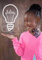 Happy office kid girl holding a bulb icon against wood wall background