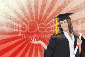 Happy young student woman holding a diploma against red and white background
