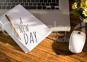 A New Day  text written on page with laptop