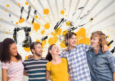 Happy young students standing against grey, yellow and black splattered background