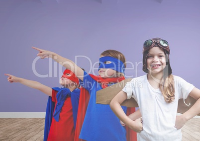 Kids in costumes in blank room