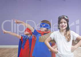 Kids in costumes in blank room