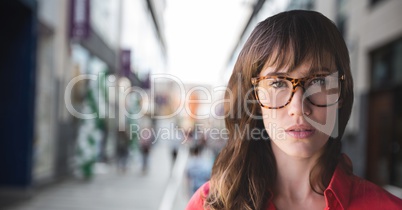 Business woman standing against street background