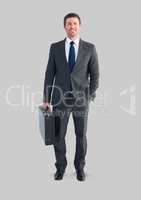 Full body portrait of man standing with grey background