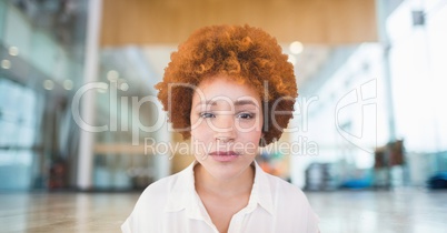 Business woman standing against office background