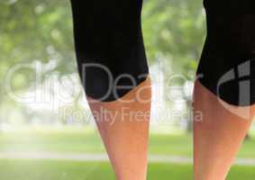 Athletic slim legs in park
