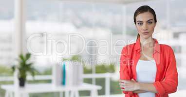 Business woman standing against office background