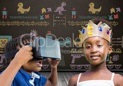 Boy with VR Headset and girl with crown in front of blackboard with toys graphics