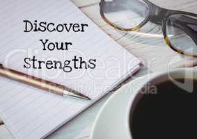 Discover your strengths  text written on page with glasses and coffee