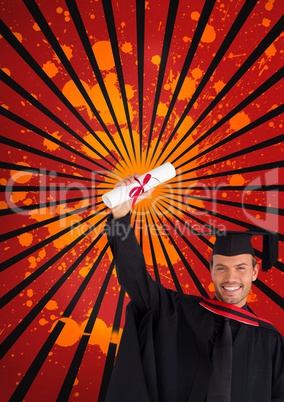 Happy young student man holding a diploma against red, black and orange splattered background